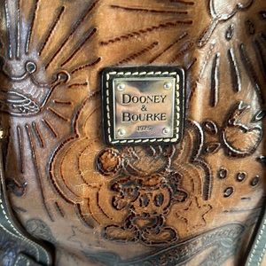 Dooney & Bourke leather Disney bag. Used and in good condition.